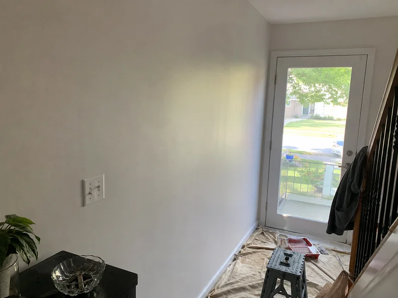 The same hallway wall after patching and painting